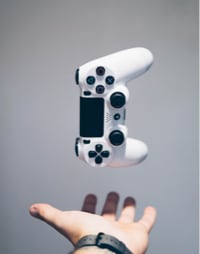 An image of a game controller being thrown up